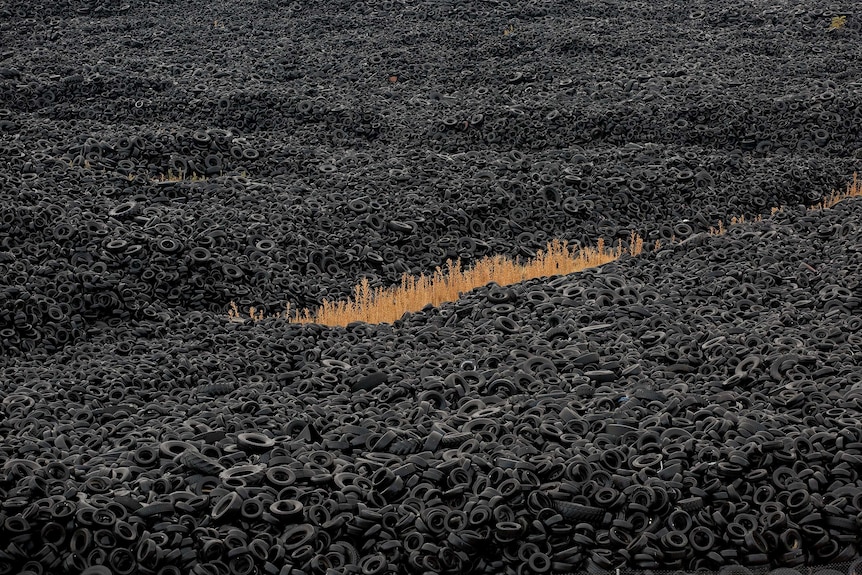 Mountains of used tyres lie on a dump in the countryside in Sesena Nuevo, near Madrid, Spain.