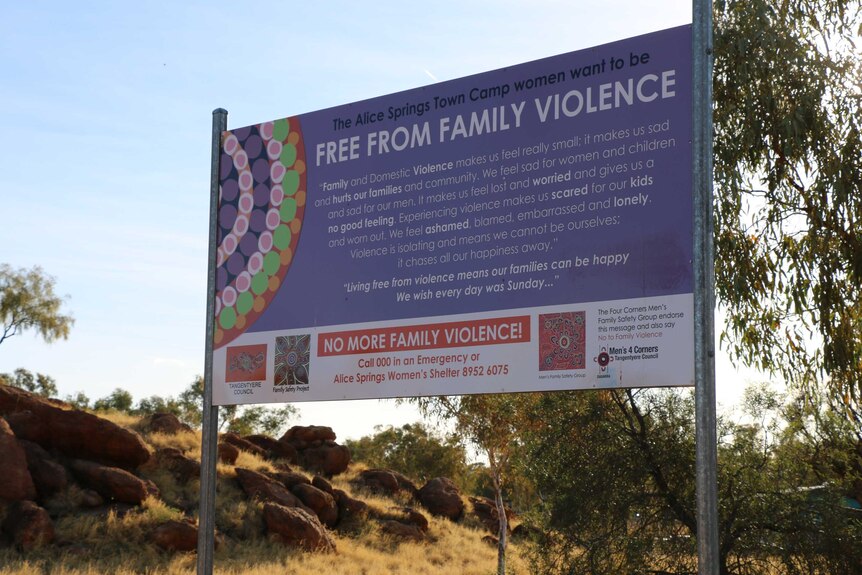 An anti-violence sign at a town camp on the outskirts of Alice Springs.