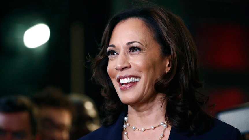 A portrait of Kamala Harris smiling while looking off camera