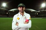 Nathan Lyon poses under lights after an Australian nets session at Adelaide Oval in November 2015.