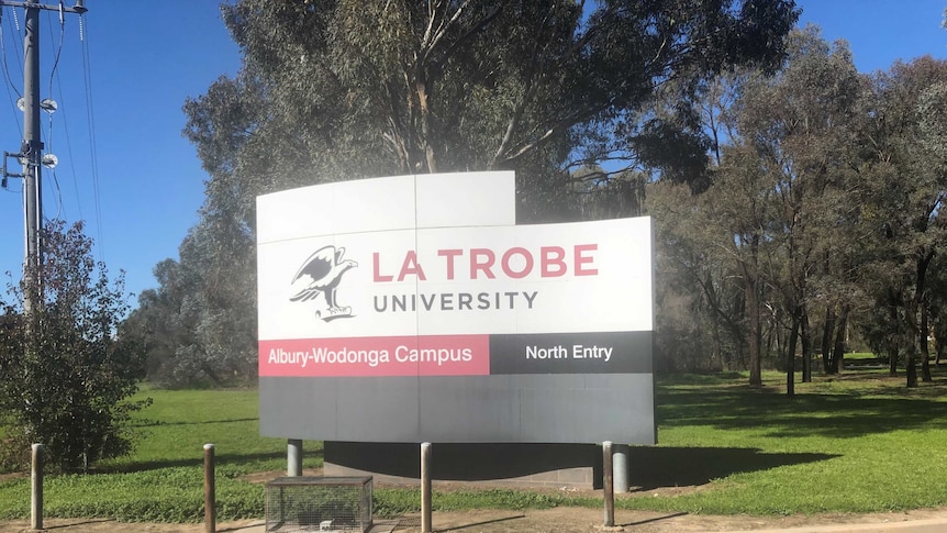 white sign with latrobe logo