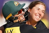 Georgia Wareham celebrates with Alyssa Healy by hugging and smiling