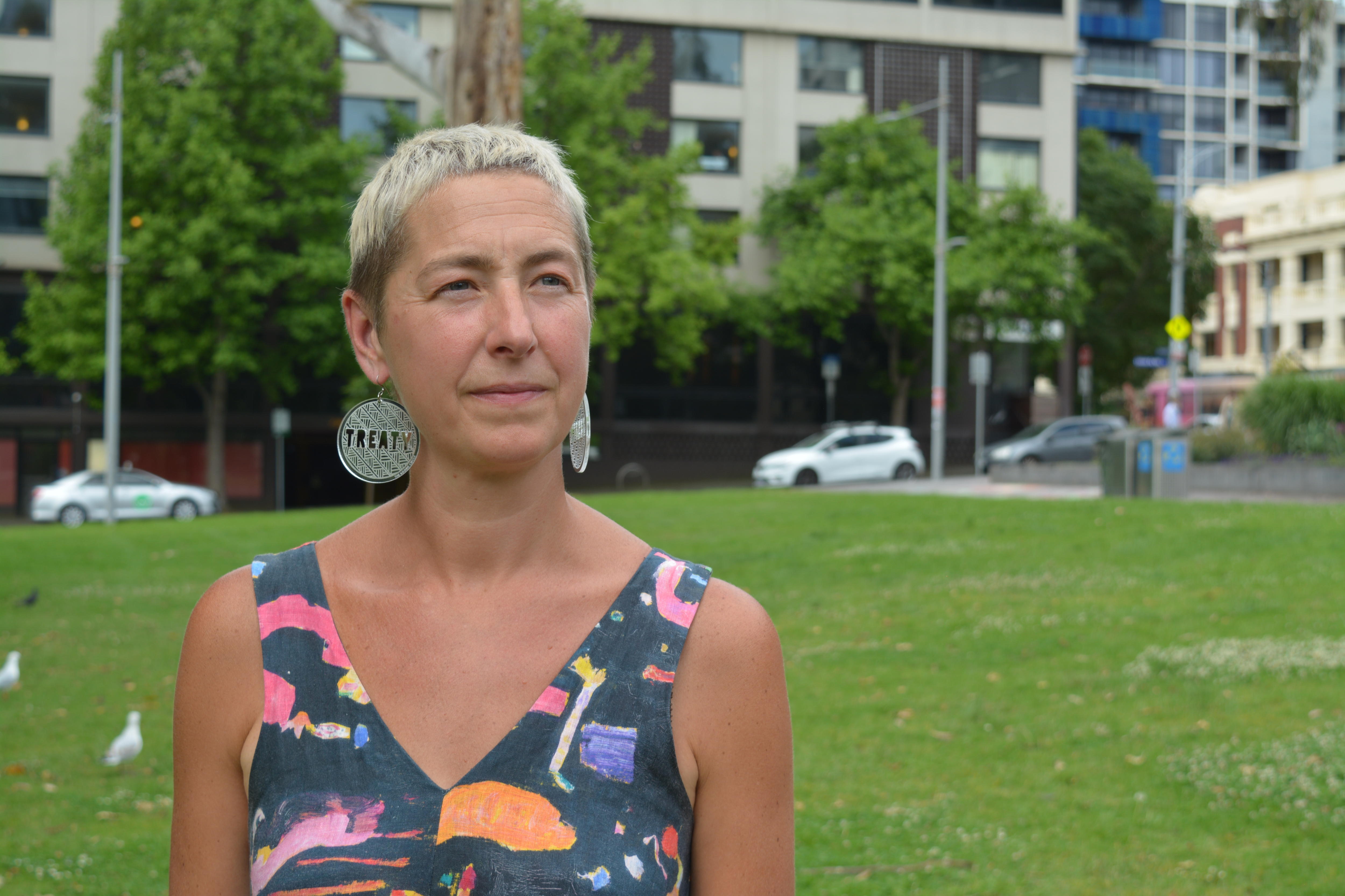 A woman with short blond hair 