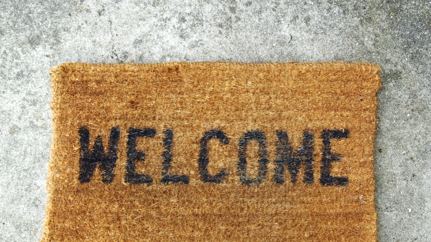 A doormat that says 'Welcome'.