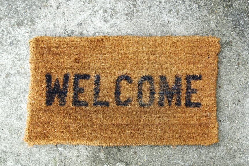 A doormat that says 'Welcome'.