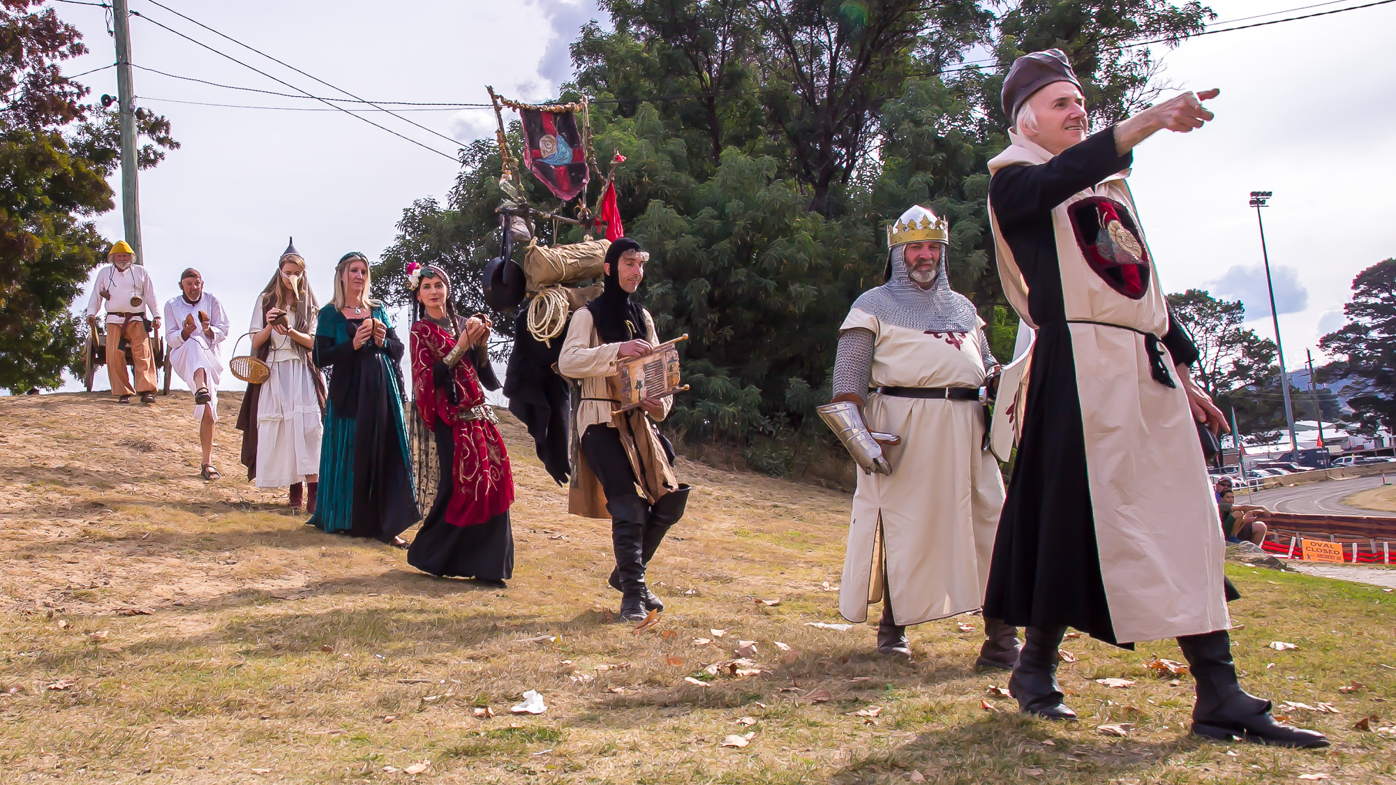 People in medieval costume walking in a line