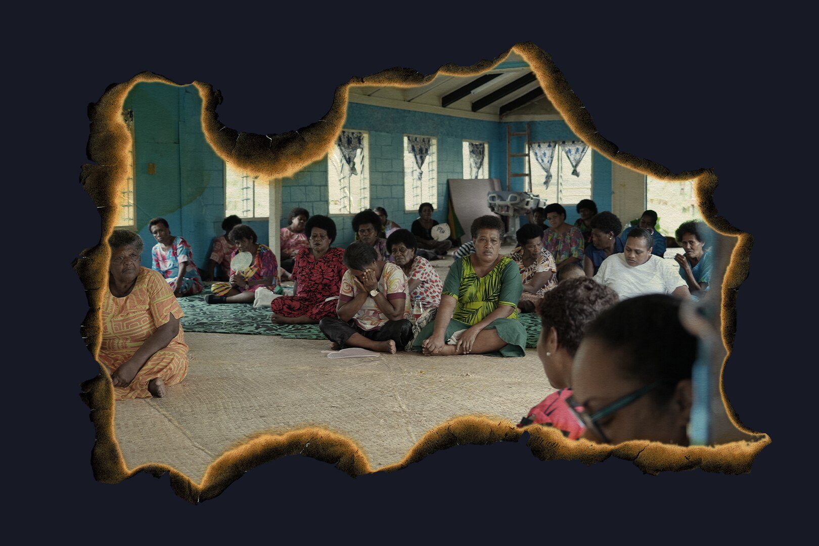An edited photo with the edges burned featuring a group of people sitting around.