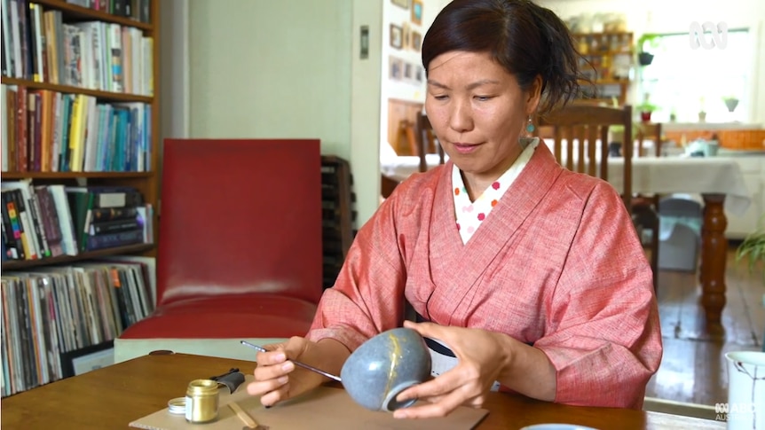 Yoko Nakazawa, a miso and koji maker based in Melbourne, repairing broken pottery using kintsugi.