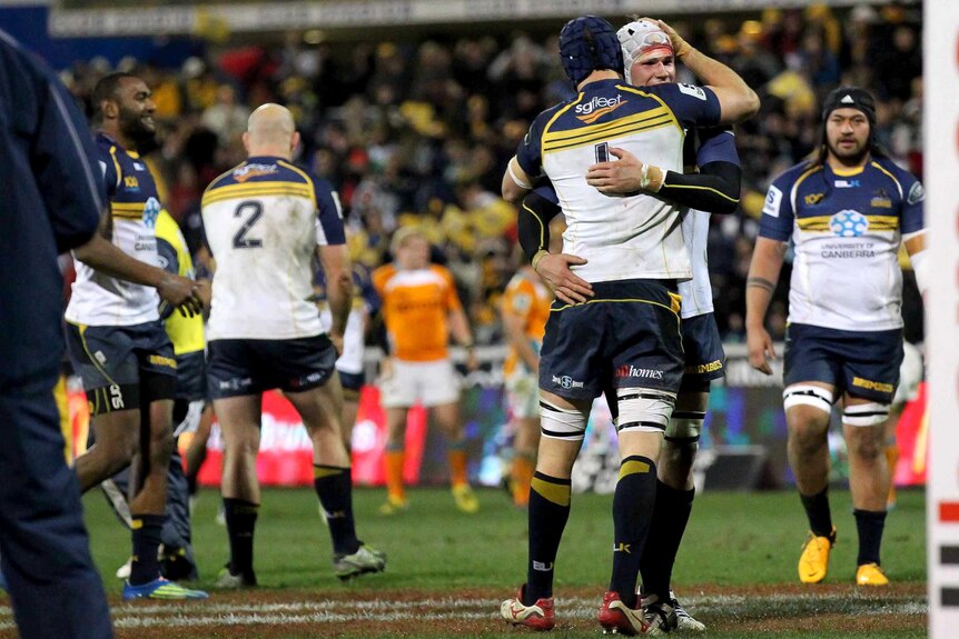 The Brumbies celebrate their win over the Cheetahs.