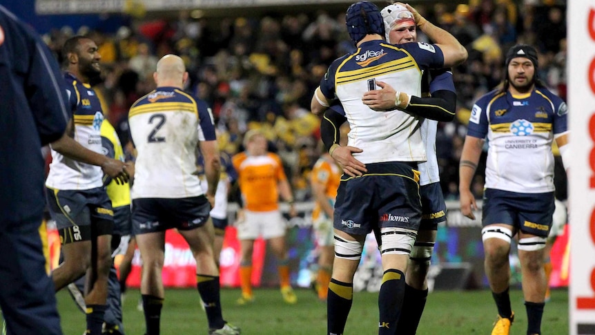 The Brumbies celebrate their win over the Cheetahs.