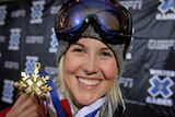 Sarah Burke poses with her gold medal after winning the Women's Skiing Superpipe at Winter X Games 13 in Colorado