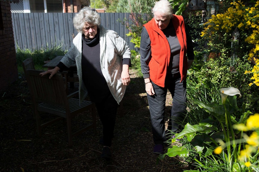 Kristin and Hilary in a patch of sun in their garden.