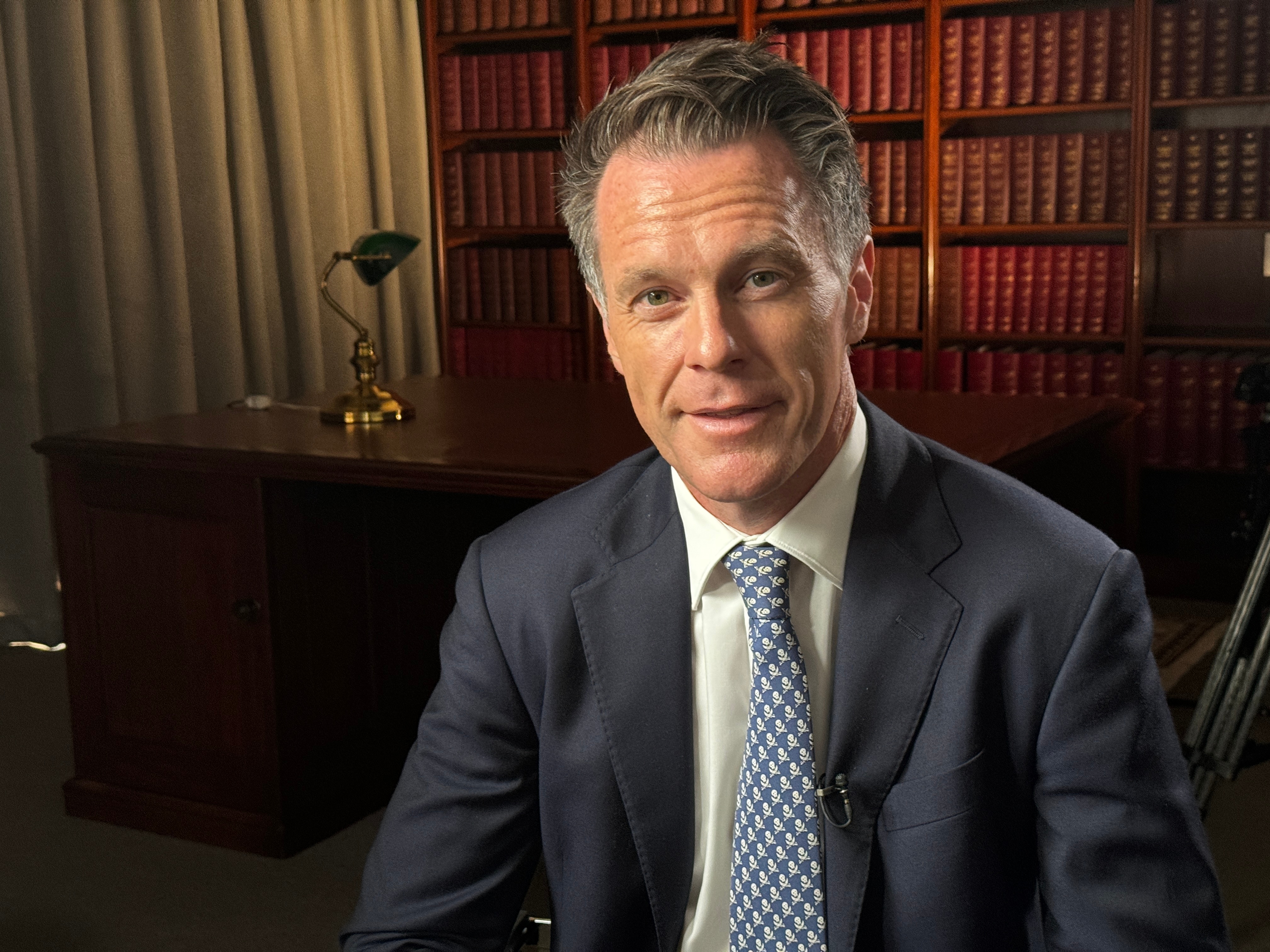 Premier Chris Minns in a blazer and blue tie