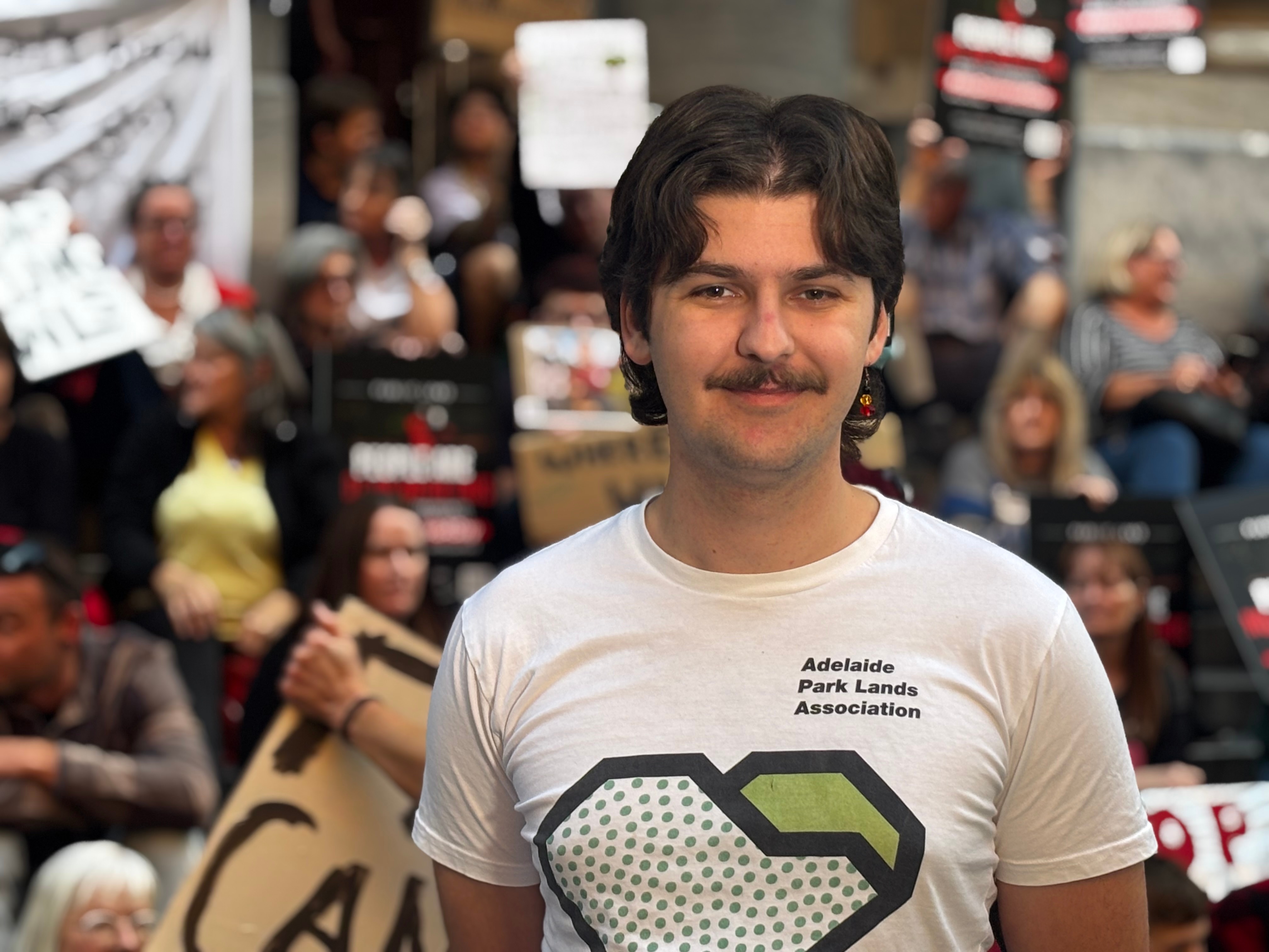 Hundreds of protesters gather on the steps of South Australia's parliament.