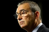 A profile portrait of Steven Marshall. He looks pensive.  He's wearing black glasses and a suit.