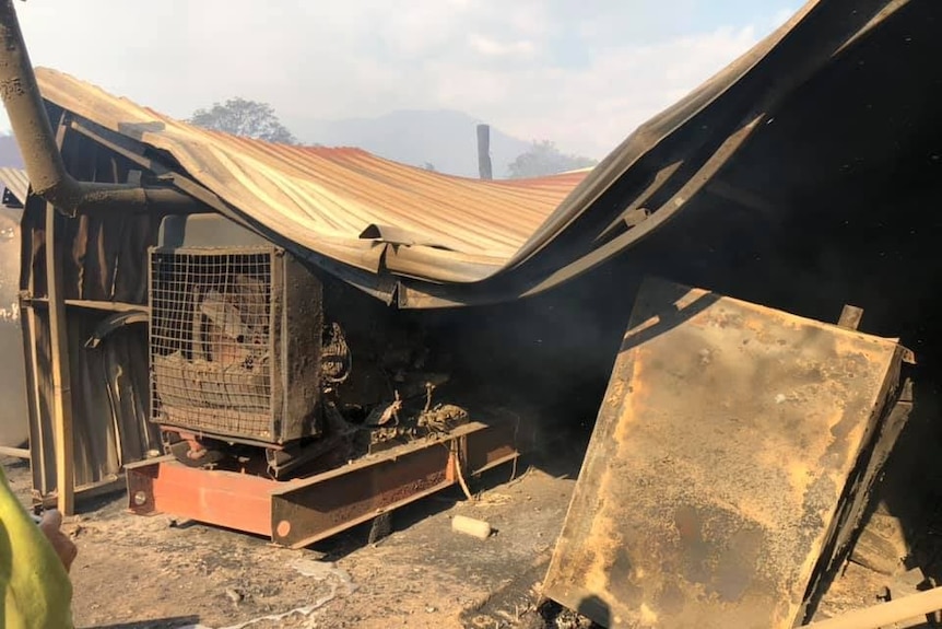 A shed and machinery destroyed by fire.