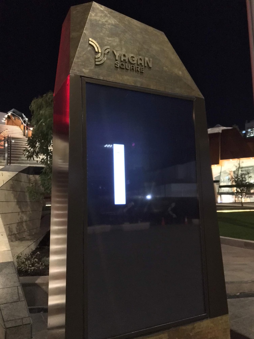 An electronic touch-screen in Yagan Square sits switched off at night.