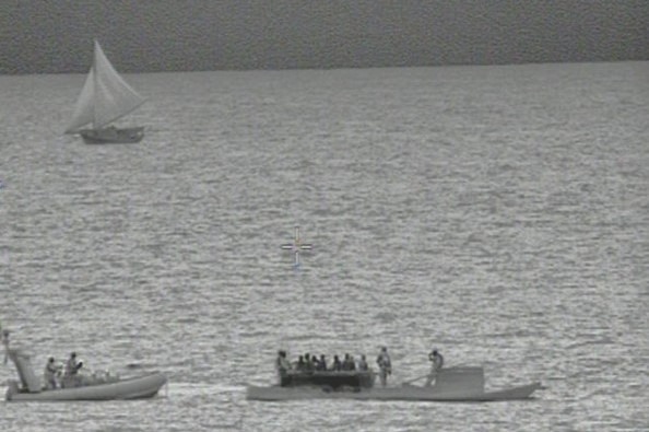 A crew of eight allegedly illegal Indonesian fishermen being apprehended off the Kimberley coast