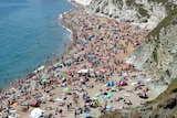 Hundreds of people packed on a beach in the UK.