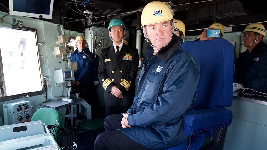 Christopher Pyne (left) shakes hands with a member of the Japanese defence force.