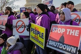 workers protest against the partial US government shutdown outside the Capitol building in Washington.