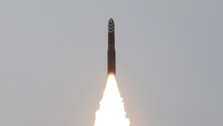 A Hwasong-18 intercontinental ballistic missile is launched into the air as part of a North Korea's test launch