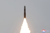 A Hwasong-18 intercontinental ballistic missile is launched into the air as part of a North Korea's test launch