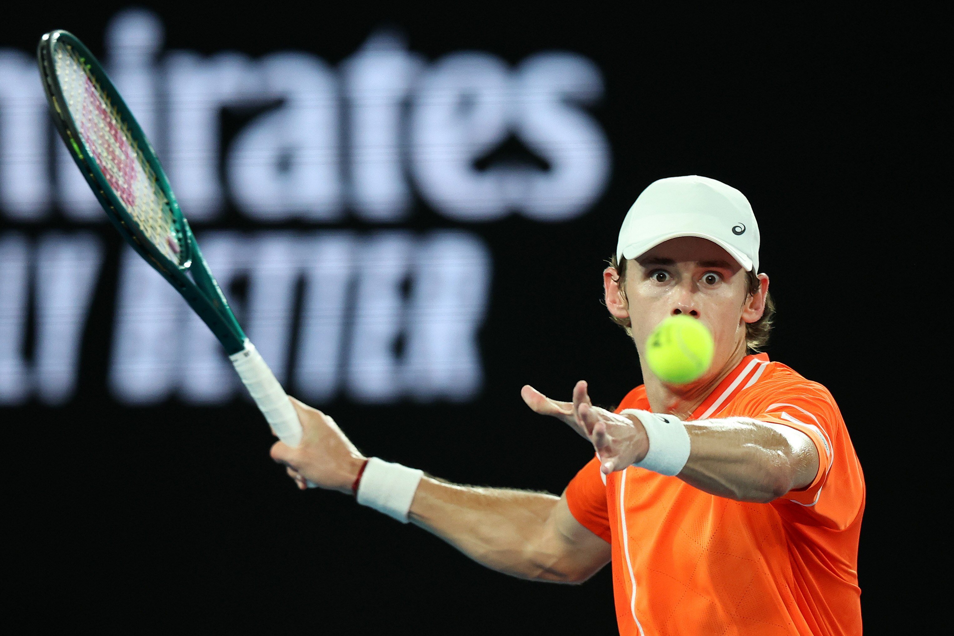 Alex de Minaur stares at the ball as he prepares to play a forehand at the 2024 Australian Open.