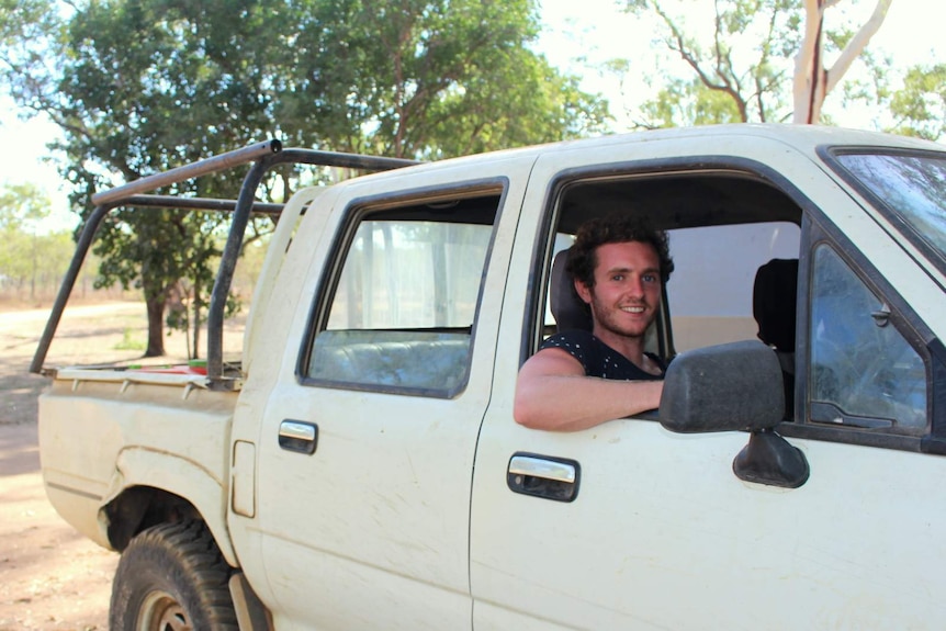 Backpacker Tom Leaning in a ute at Lorella Springs.