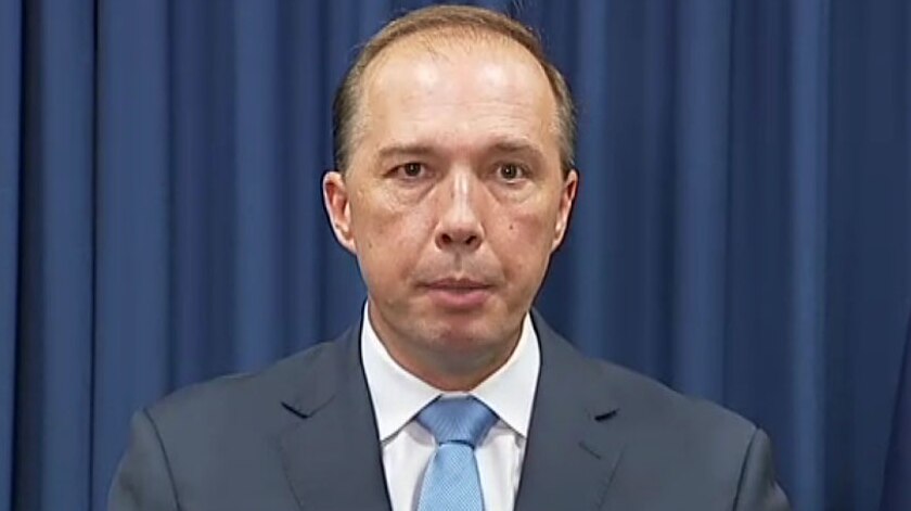 Immigration Minister Peter Dutton addresses the media