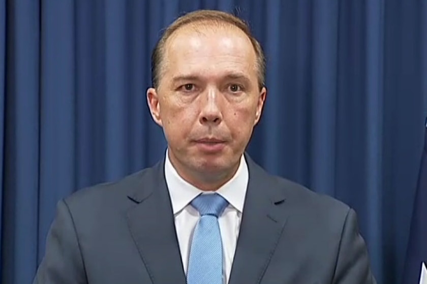 Immigration Minister Peter Dutton addresses the media