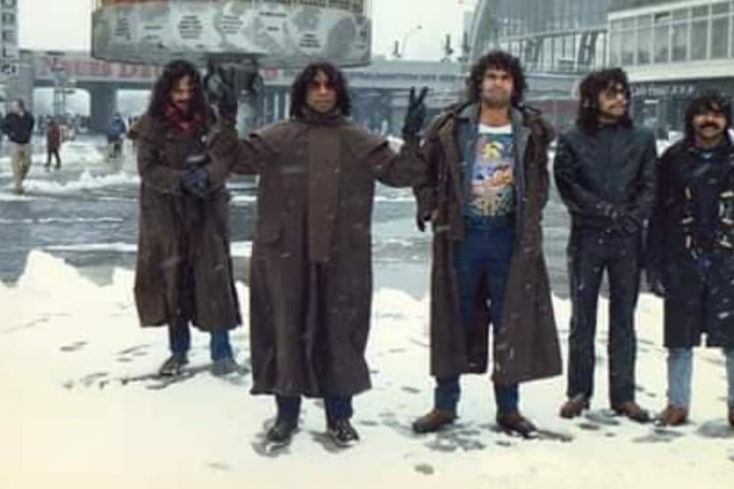 five members of No Fixed Address stand in the snow on tour in Berlin 1987