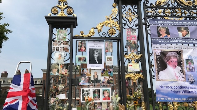 Photographs and flowers line the gates of Buckingham Palace, ahead of the 20th anniversary of her death.