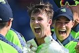Curtis Campher and Irish teammates smile and hug at the Twenty20 World Cup.