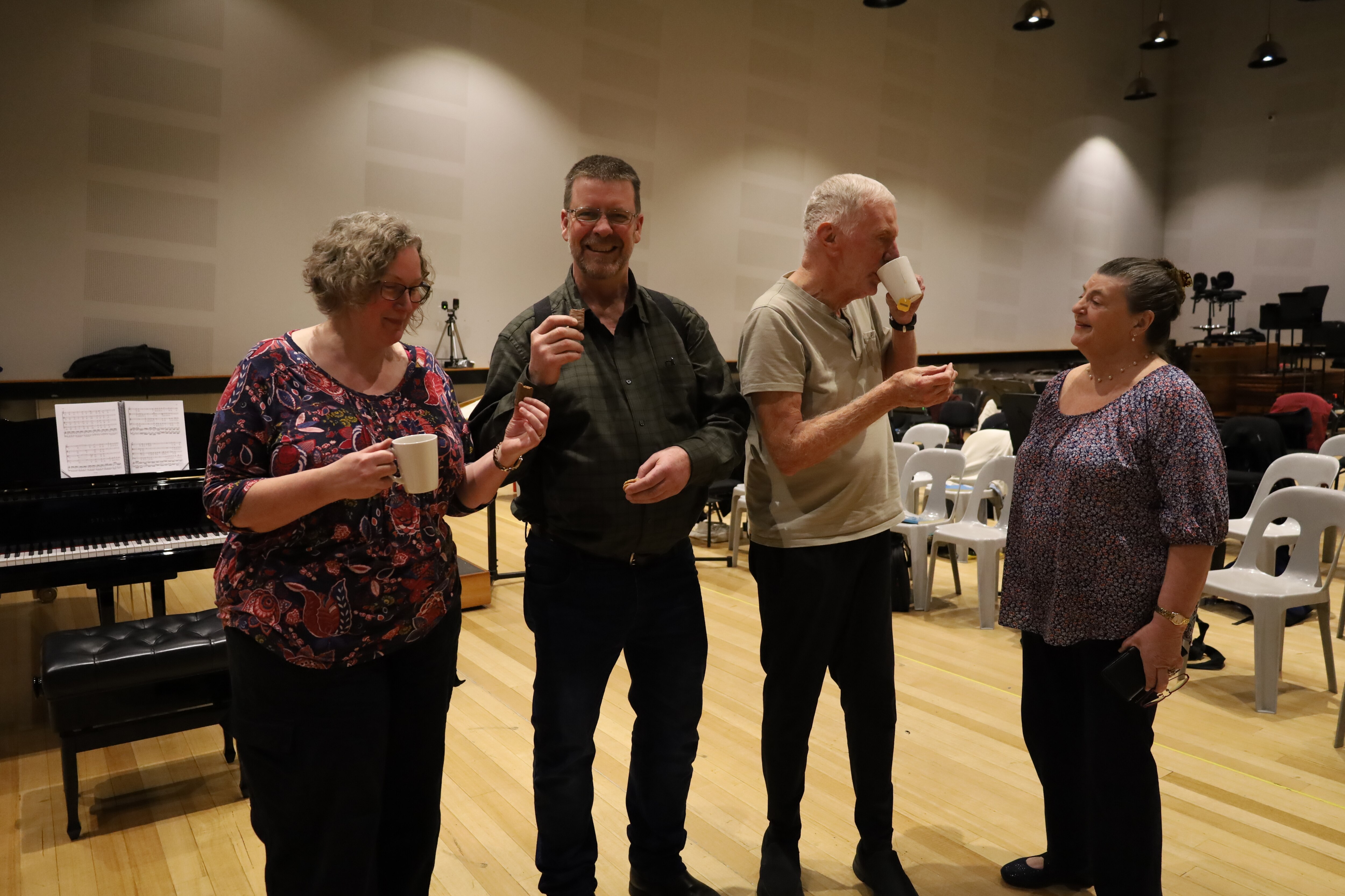 Tasmanian Symphony Orchestra Chorus members enjoying Tim Tams