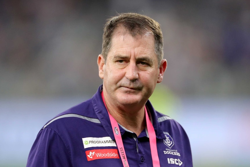 A headshot of Ross Lyon walking on Perth Stadium