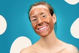 Smiling woman with a clay mask on her face, in a story about debunking the natural, clean skincare trend.