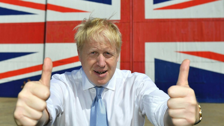 Boris Johnson gives two thumbs-up to the camera.