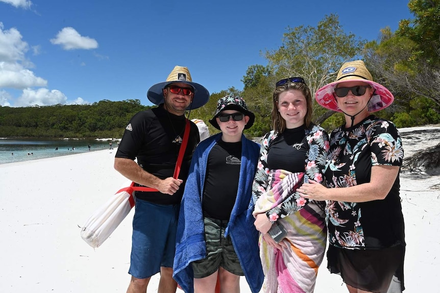 Troy, Hayden, Ruby and Amanda Frazer stand together at Lake McKenzie on Fraser Island.