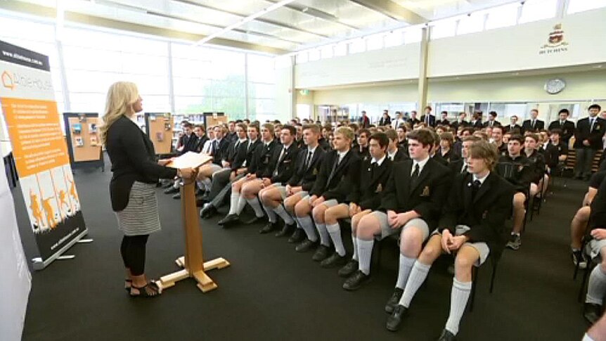 Albie House's Amanda Cuthbertson speaks to students at Hobart boys school.