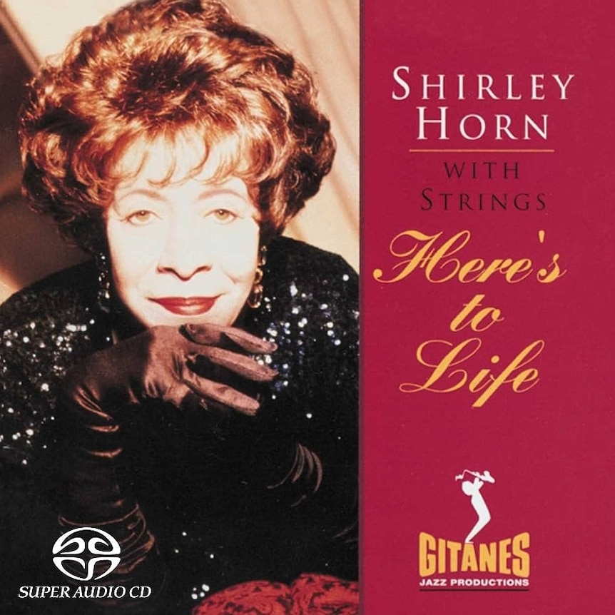 A tight crop of Shirley Horn's face; she's wearing a black formal dress and gloves