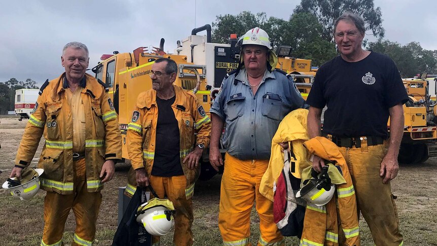 Four rural volunteer firefighters finish a 12 hour shift battling the Deepwater bushfires.