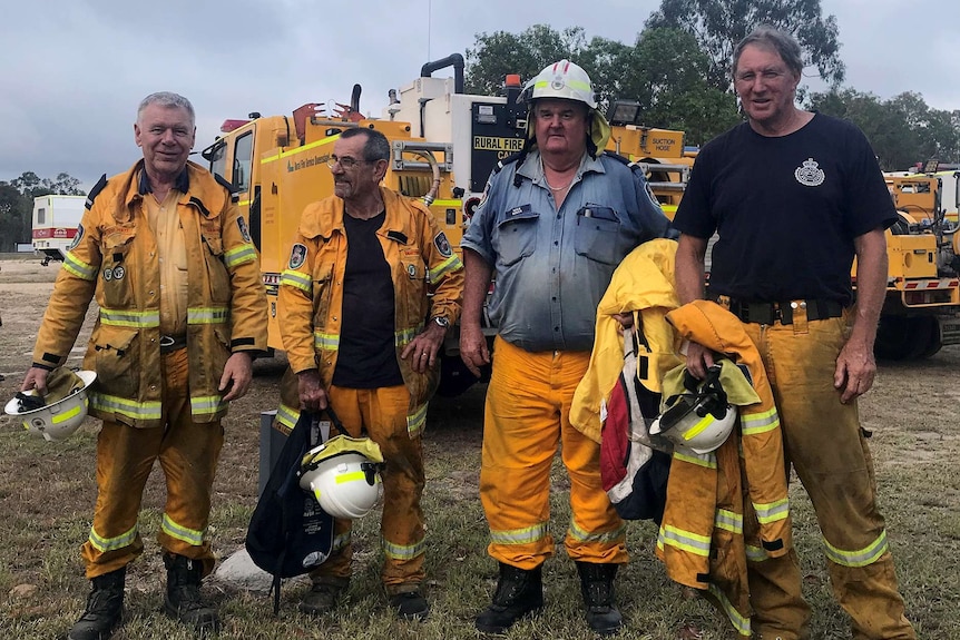 Four rural volunteer firefighters finish a 12 hour shift battling the Deepwater bushfires.