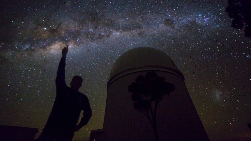 Night sky from Siding Spring with person and telescope