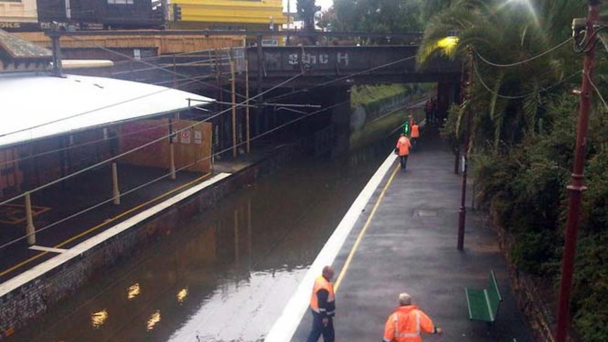 The train tracks were flooded by the rainwaters.
