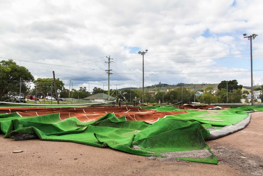 Artificial turf at Dengog tennis courts ripped up after storms