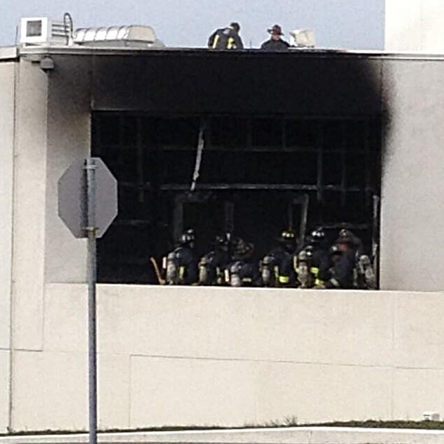Firefighters at the scene of an explosion at JFK Library.