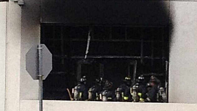 Firefighters at the scene of an explosion at JFK Library.