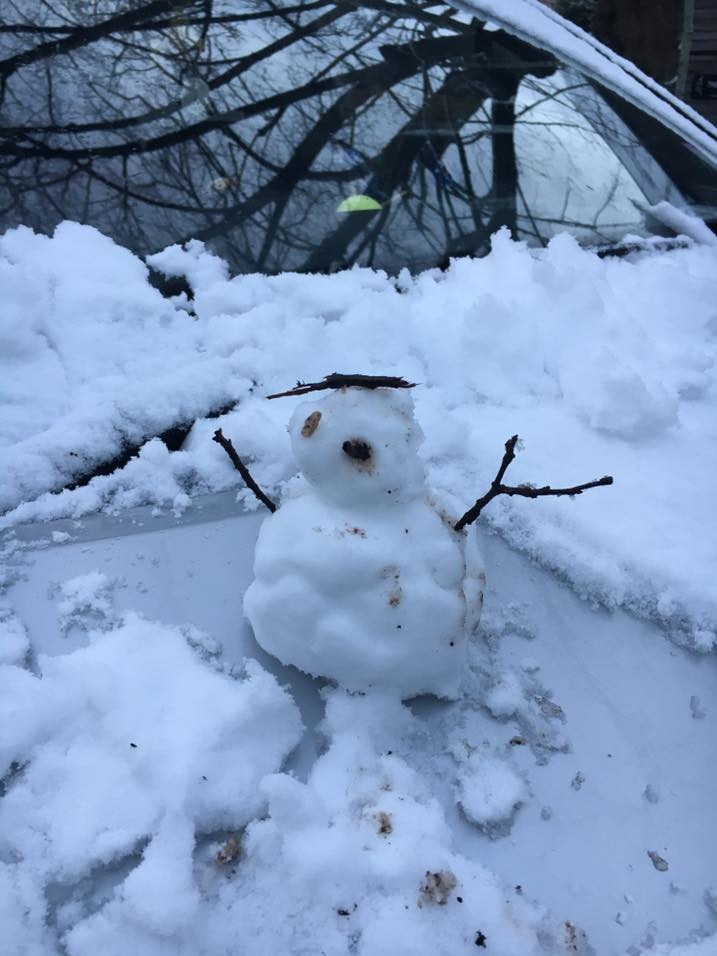 A snowman on the bonnet of a car parked near Daylesford in Victoria.