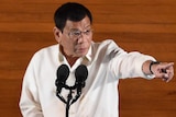 Philippine President Rodrigo Duterte gestures at lectern